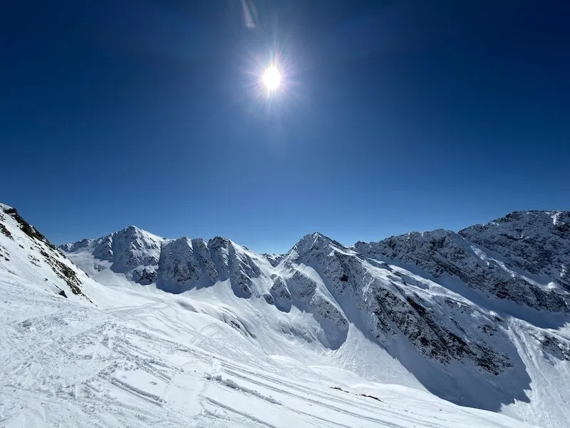 Breathtaking mountain panorama with fresh snow and clear blue sky on the Brunnalm